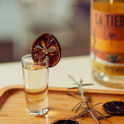e: Sunsets in Soweto (Reposado Neat) Alt Text: Sunsets in Soweto cocktail served neat with La Tierra Agave Reposado, a 100% Karoo agave spirit and South African tequila.